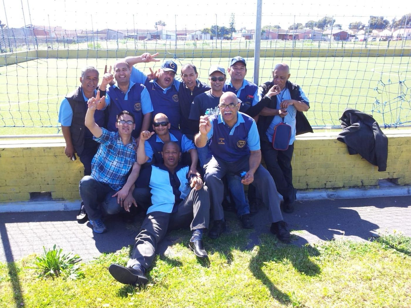 Club members celebrating outdoors together on a match day